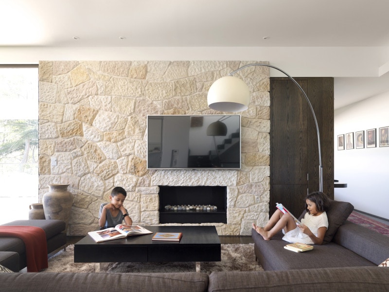 Sandstone Living Room Feature Wall Recessed Fireplace, Timber Sliding Door, Highlight Window, Study Desk