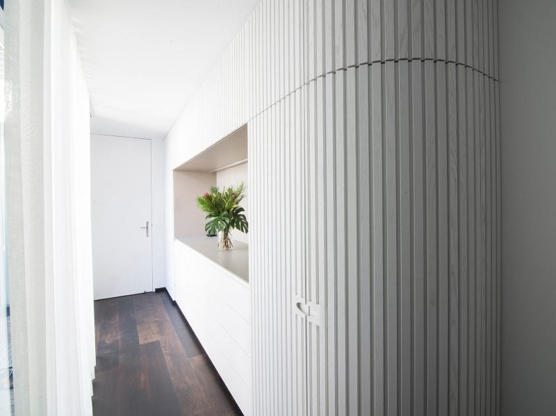 Luigi Rosselli, curved white ribbed timber panel wall