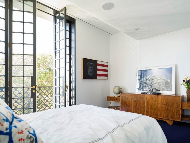 Luigi Rosselli Architects | Interiors Woollahra Terrace house bedroom, tall french doors, Juliet balcony, fishscale balustrade