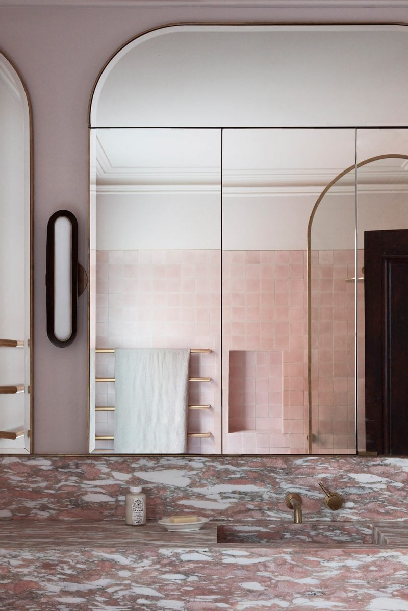 This Calacatta Viola has creamy white clasts floating in a sea of pink marble. The master ensuite vanity complements the pale pink wall tiles and gold towel rails