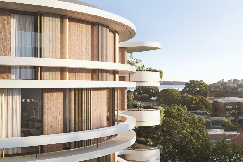A closeup of the balconies -- strong white horizontal 'rings' form the balustrades and sunshades throughout the building, while copper aluminum sliding shutters provide privacy and sun control