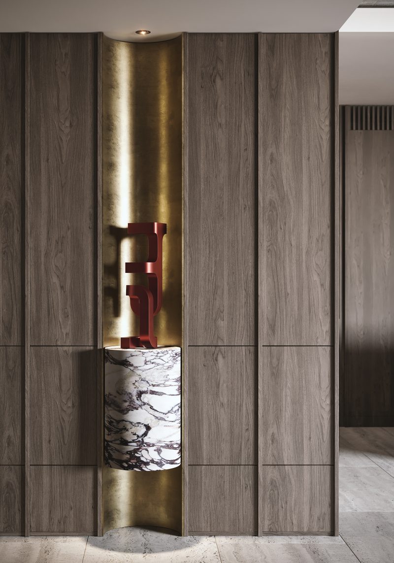 sculptural art, luxury centerpiece accented by brass curved wall and marble built into the timber joinery