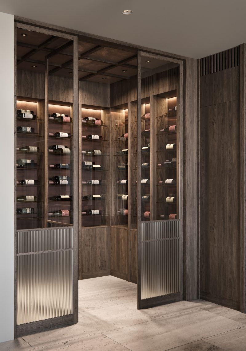 Heavy Travertine flooring leads from the kitchen to the cellar, timber cabinets displaying wine, sliding fluted glass door