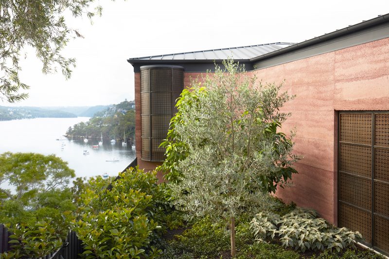 Perched on a hill between the trees, Luigi Rosselli's Earth-ship overlooks the Sydney harbor