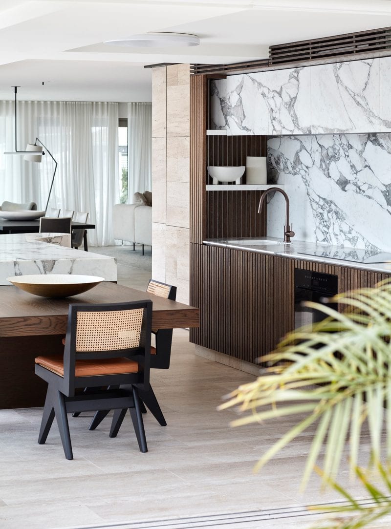 Luigi Rosselli's Upper Deck kitchen, white Calacatta Vagli stone splashback with timber joinary