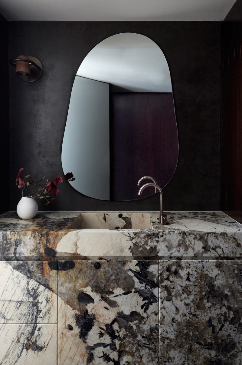 Luigi Rosselli, Alwill interiors, Powder Room, spotted Patagonia marble sink contrasting with the matte black wall finish of Porter's Paint Jaguar