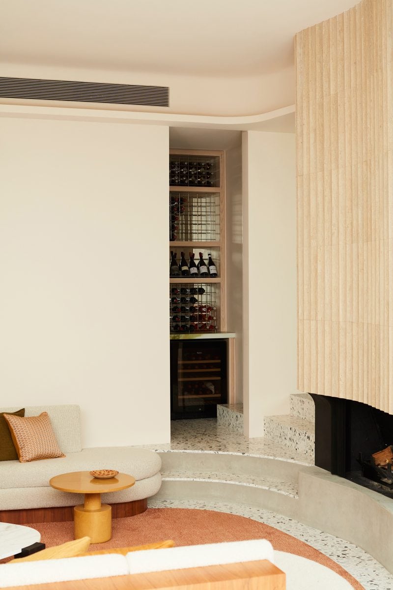 Luigi Rosselli Architects, lounge, curved fireplace, texture., a hidden wine store beside the loungeroom